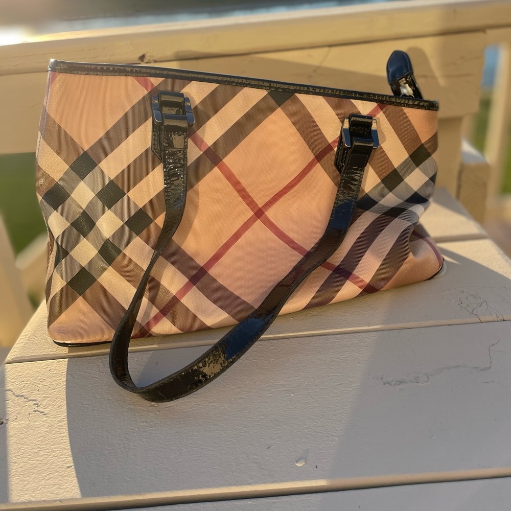 authentic Burberry medium Tote used with exposed piping with bag